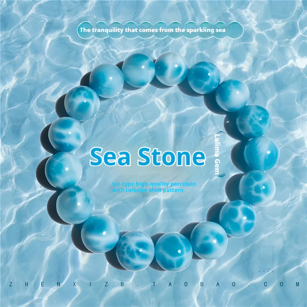 Blue handmade bodhi and pearl bracelet in Maillard style on a neutral background.