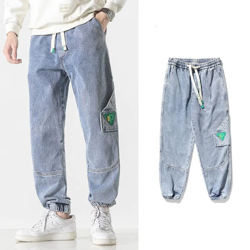 Men's loose-fit tapered cotton trousers in black colour showing mid-rise waist and tapered leg silhouette
