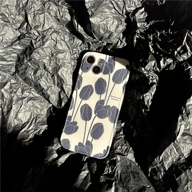 Black tulip patterned silicone iPhone case shown on an iPhone