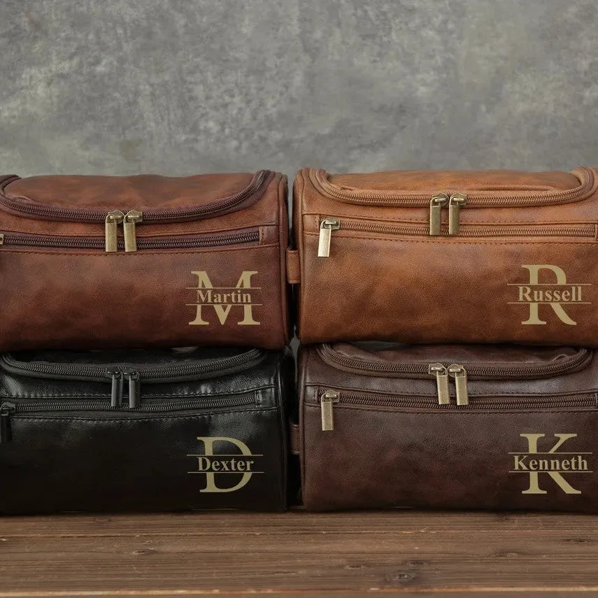 Men's neutral-coloured PU travel organiser with multiple compartments open showing interior layout
