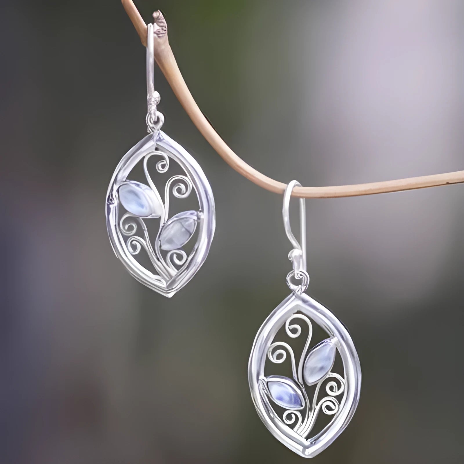 Women's silver alloy earrings with leaf design and embedded colourful moonstone gemstones