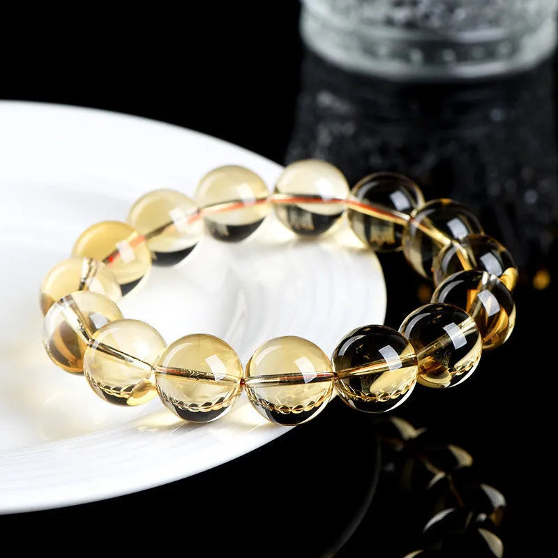 Natural citrine scattered bead bracelet showing polished yellow gemstone beads in an irregular design.