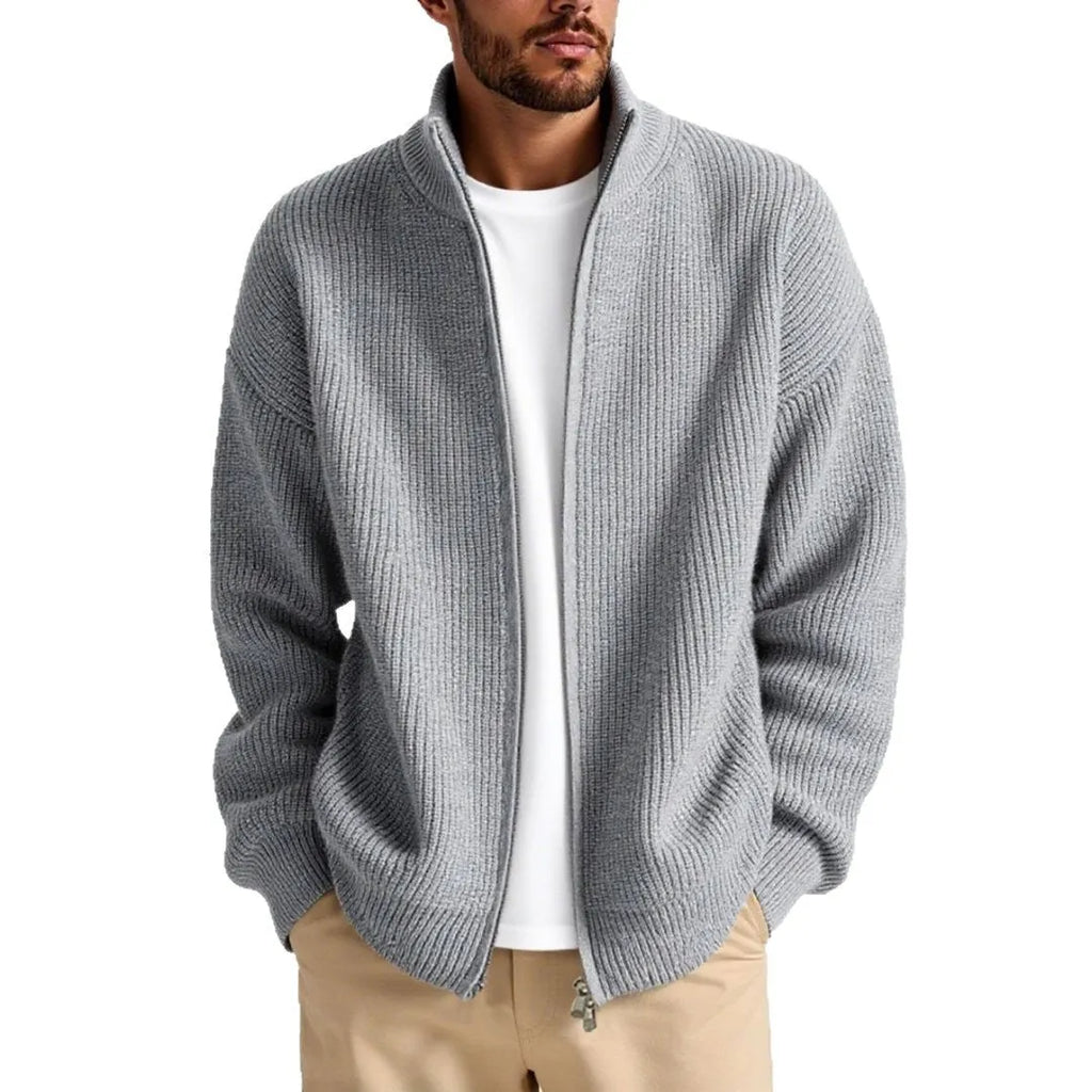 Man wearing a loose-fit grey cardigan sweater coat for casual leisure wear.