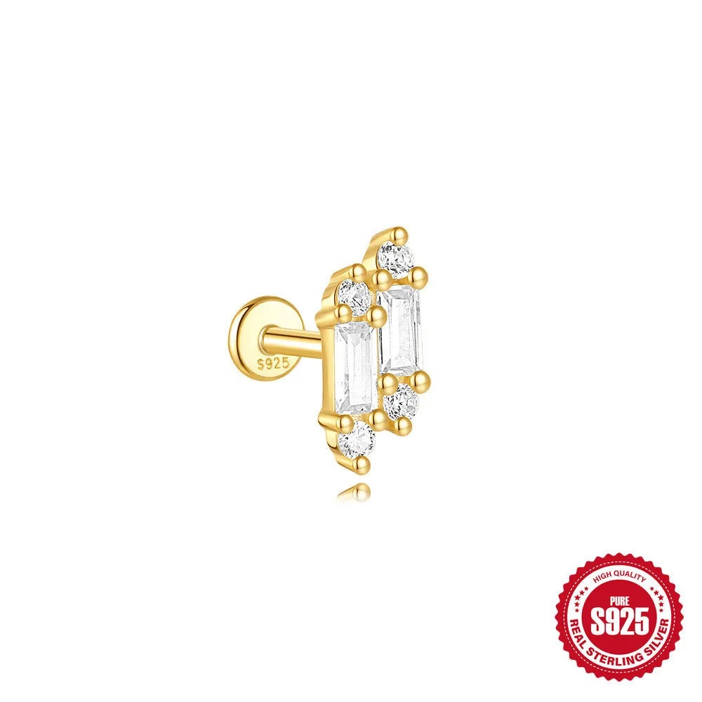 Geometric kite-shaped sterling silver earring with rhinestone head and gold chain tassel.