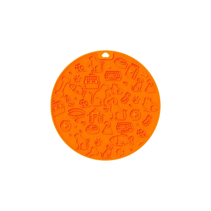 Round silicone pet licking mat with suction cup base in blue colour on a floor.