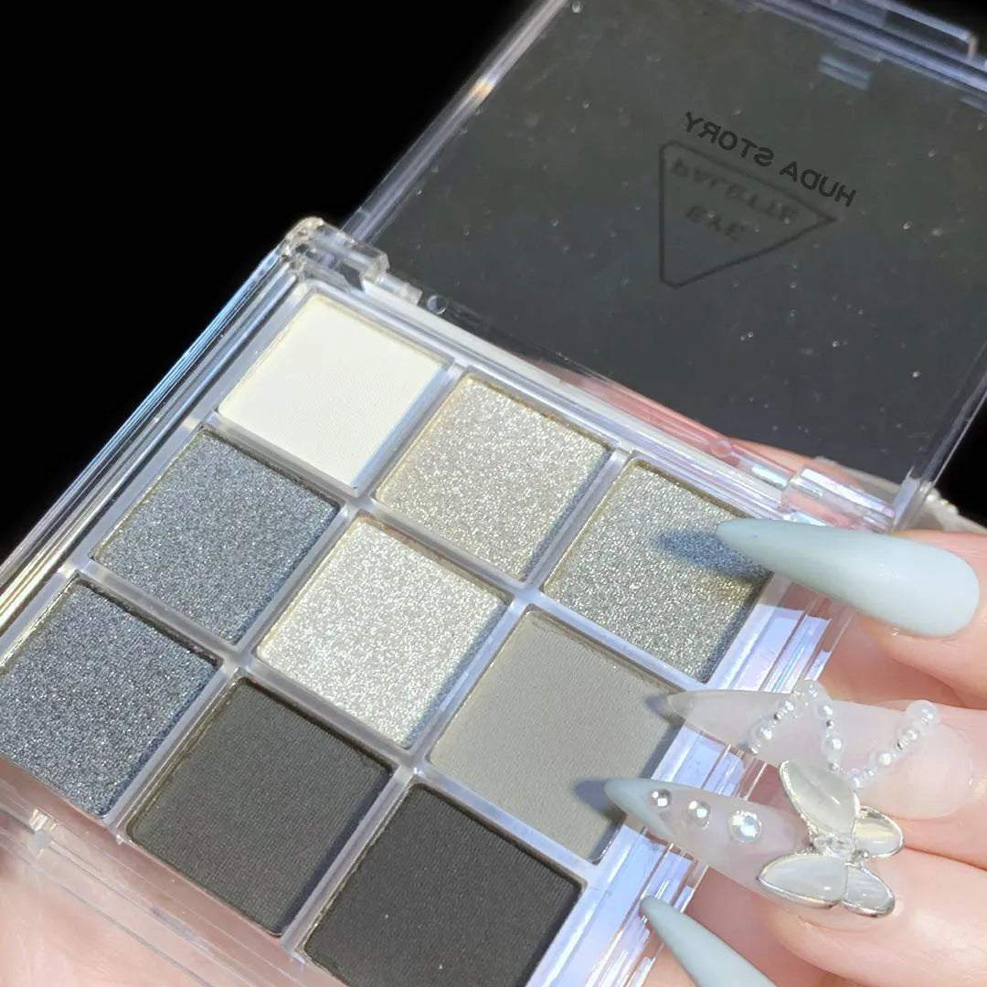 9-colour smoked eyeshadow palette showing white, silver, black and iron grey shades