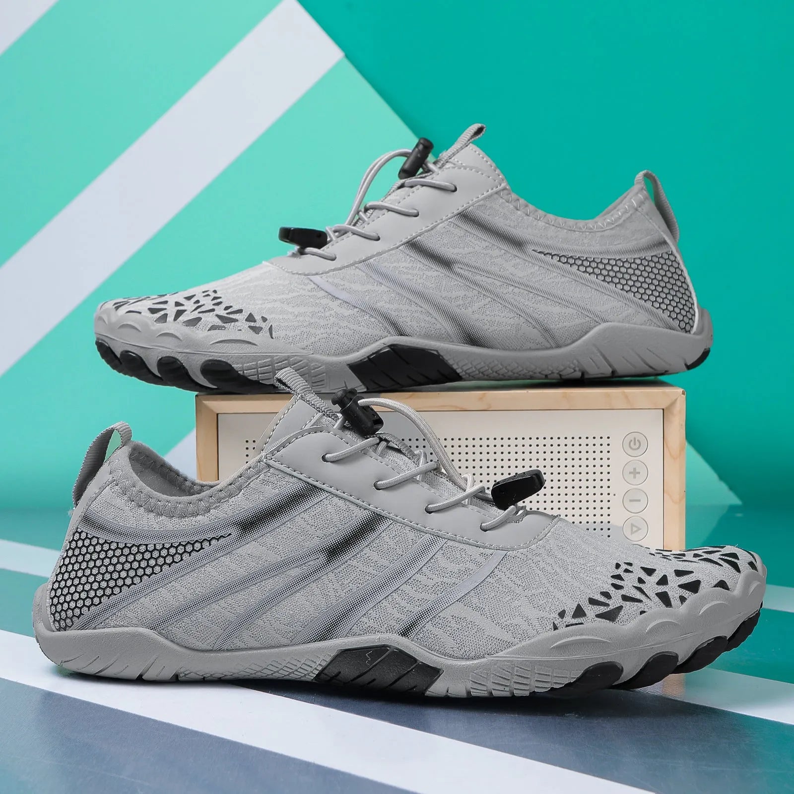 Lycra stretch fabric casual running shoes for men and women on a beach background.