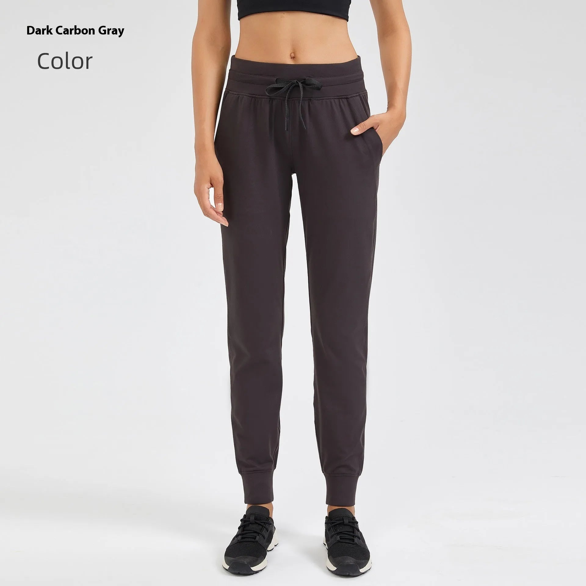 Women's high-waist yoga pants with drawstring waistband in distilled coffee colour, suitable for fitness.