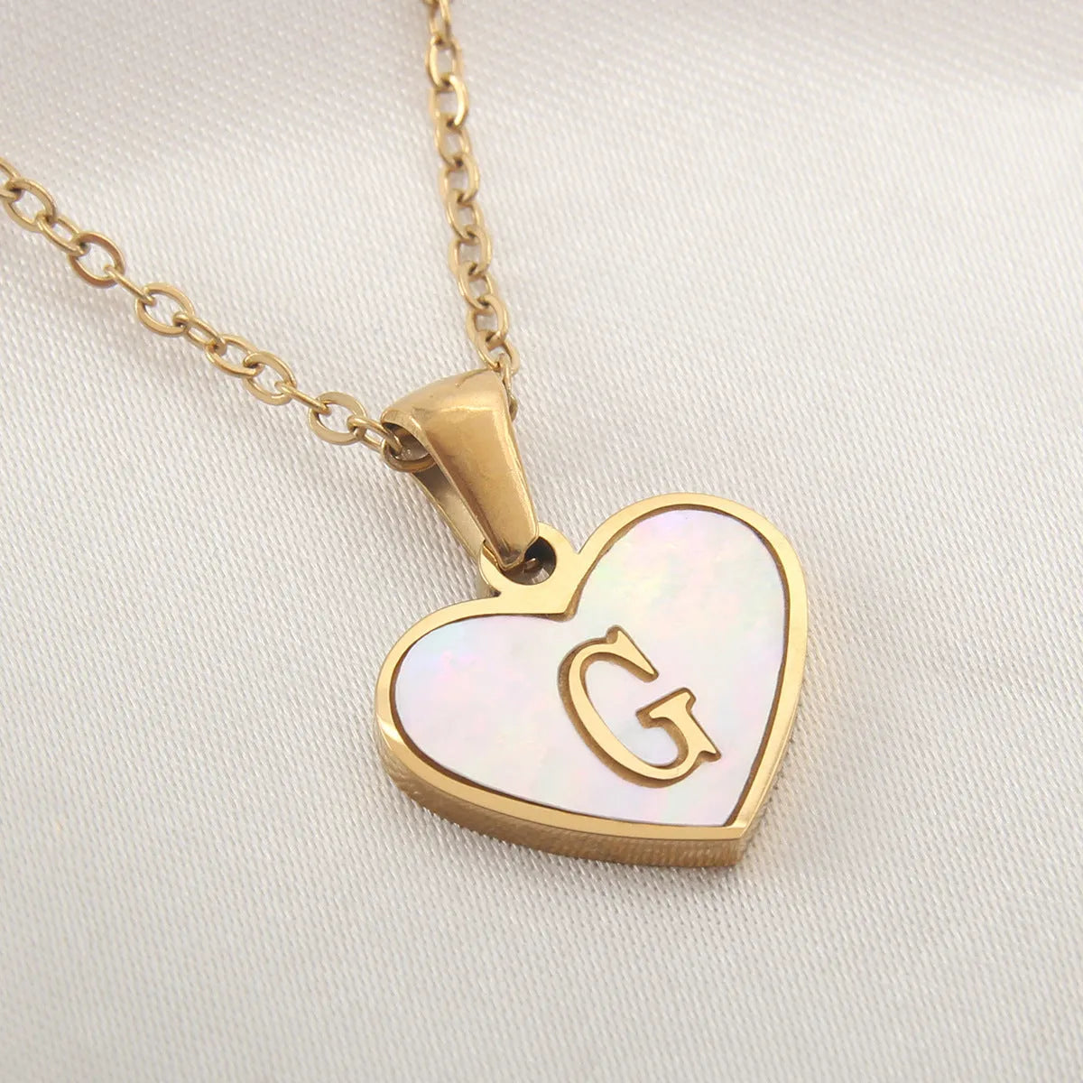 Gold plated personalised heart necklace with white shell on a 45cm chain