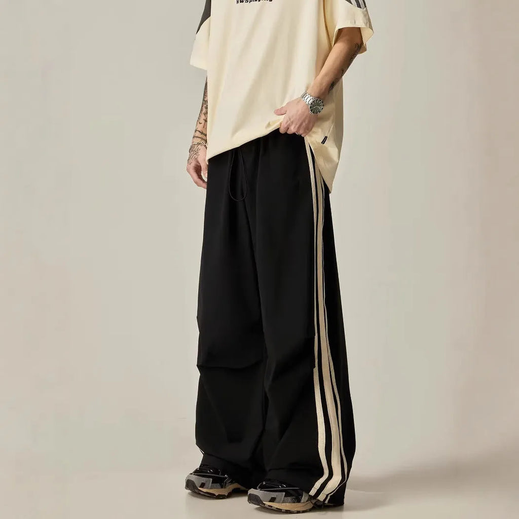 Black wide-leg climbing trousers with high waist design shown flat