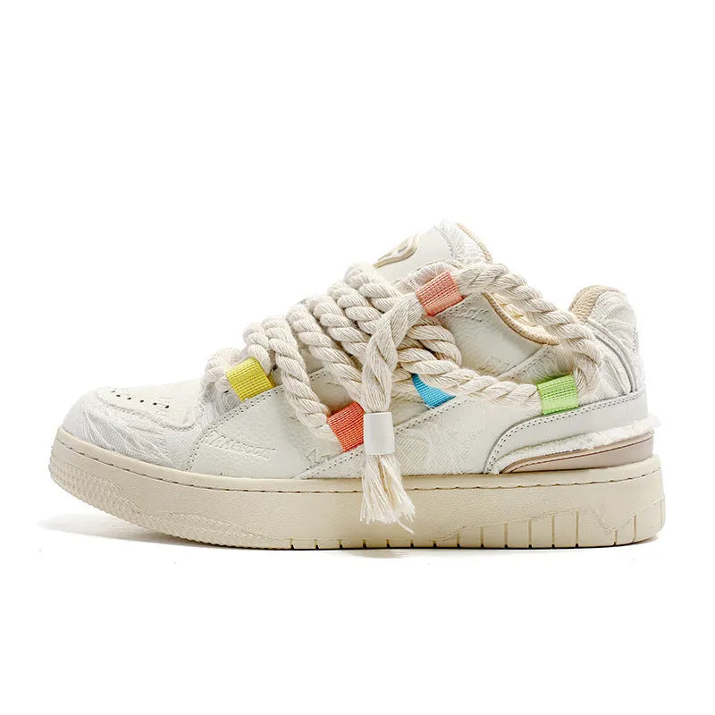 Old Damage creamy white retro low-top skate shoes with lace-up front and platform sole.