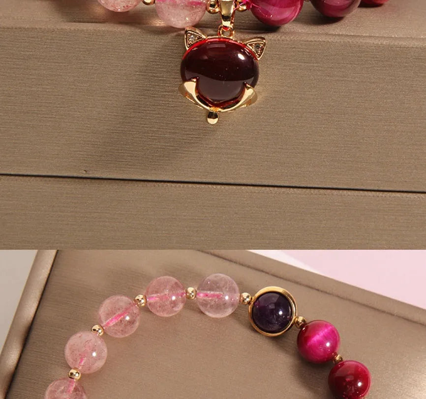 Women's strawberry crystal bracelet on elastic rope showing natural bead texture and uniform 18cm size