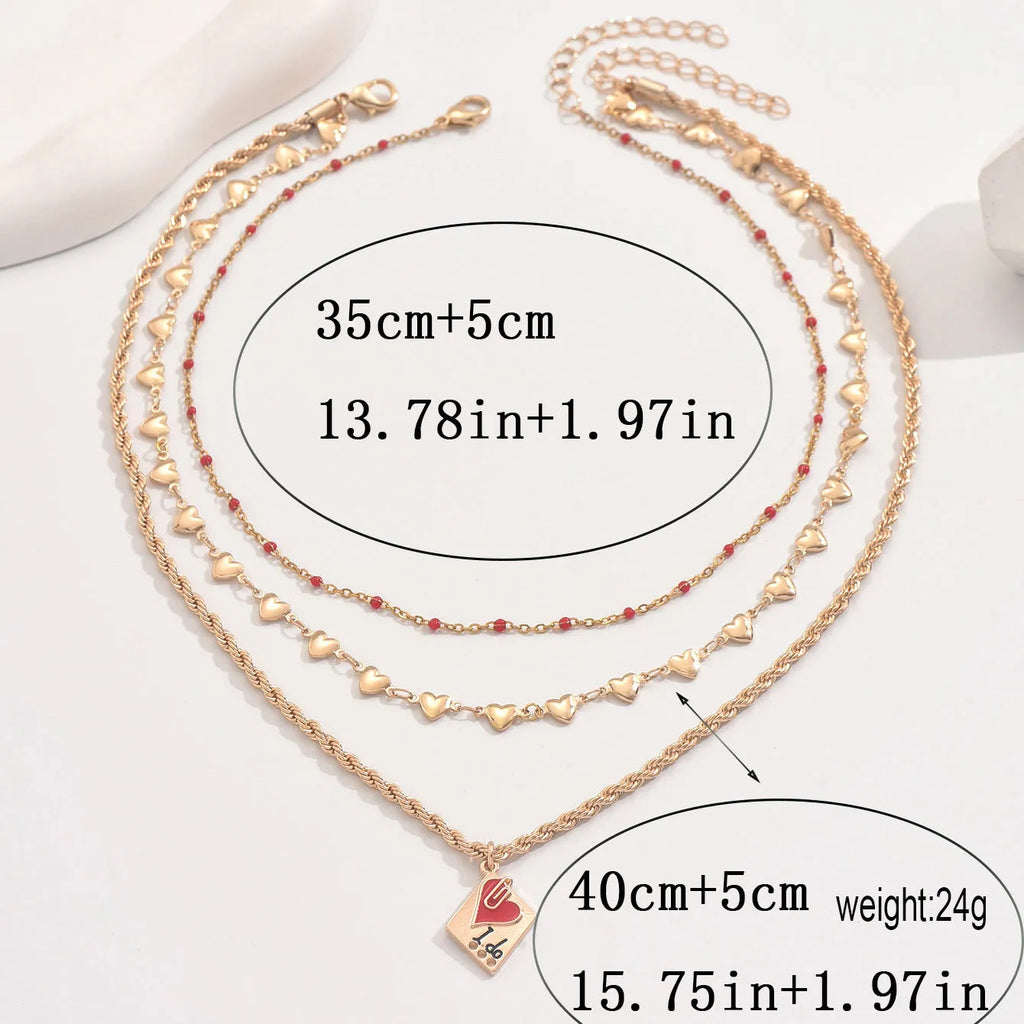 Gold-toned three-layer love heart necklace with geometric clavicle chain, adjustable 41-50cm