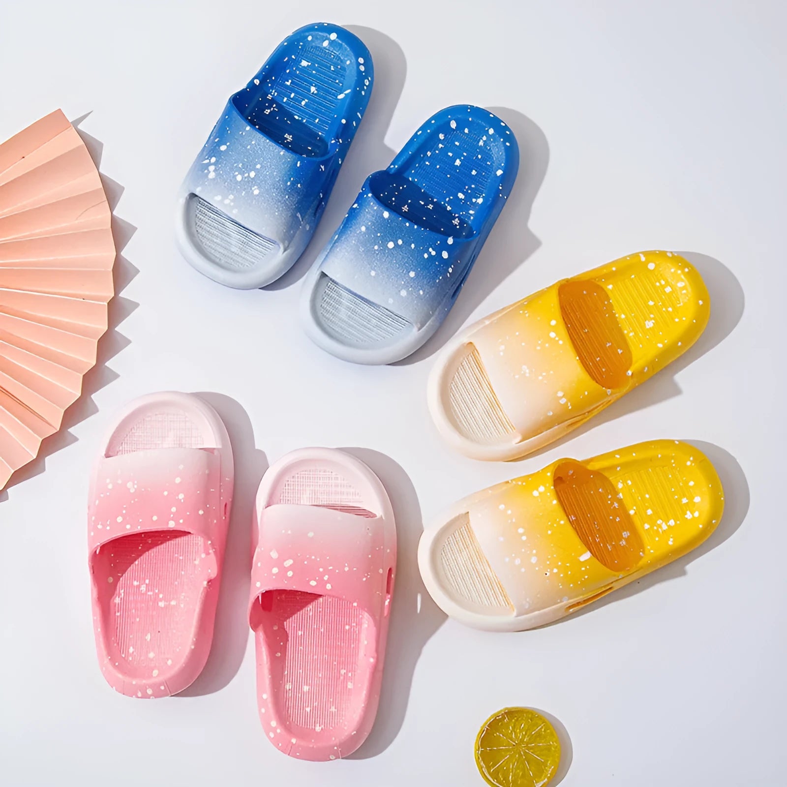 Gradient coloured PVC summer slippers for children on a non-slip sole.
