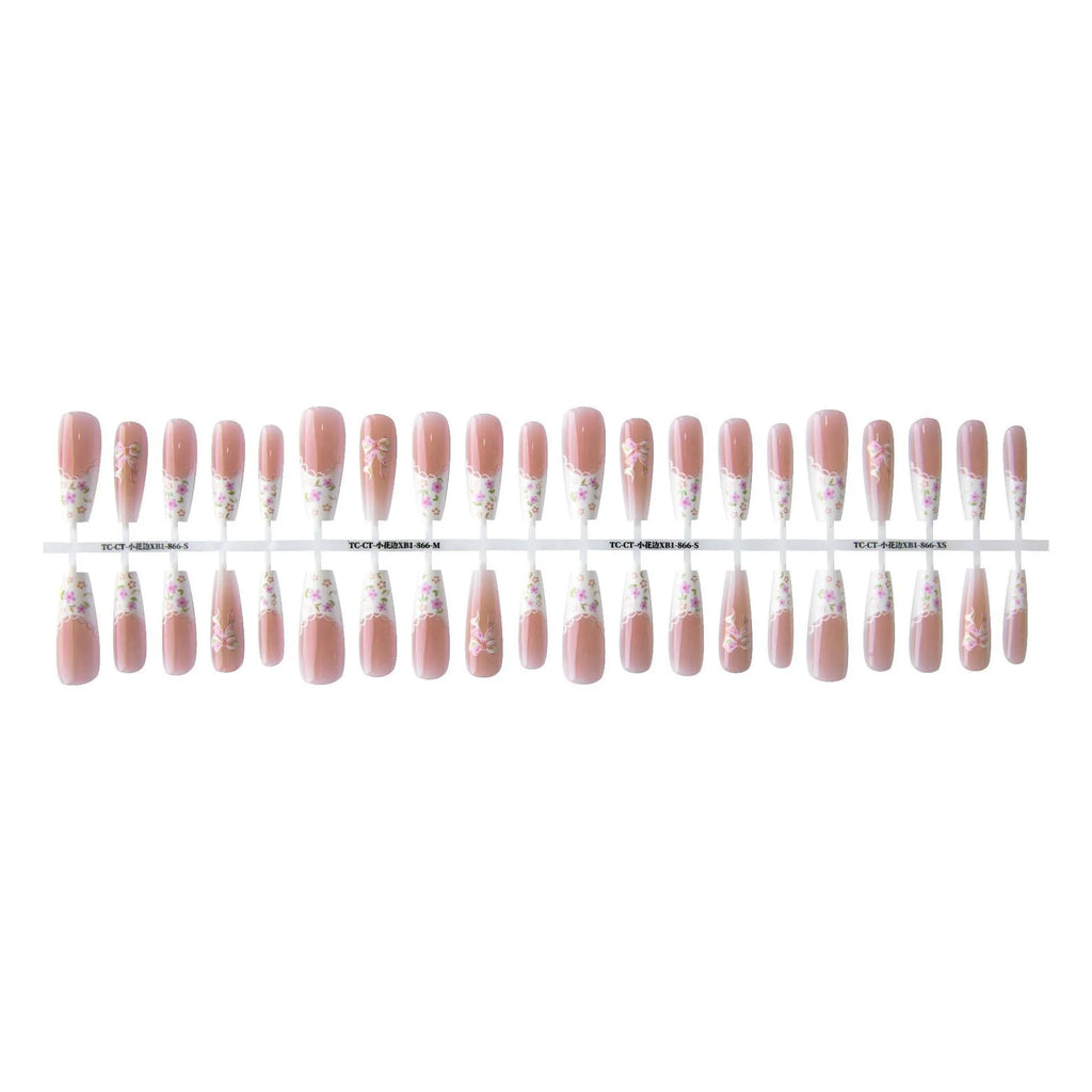 Set of 40 small floral prefabricated nail tips with long ladder velvet seal layer in white, displayed on a flat surface