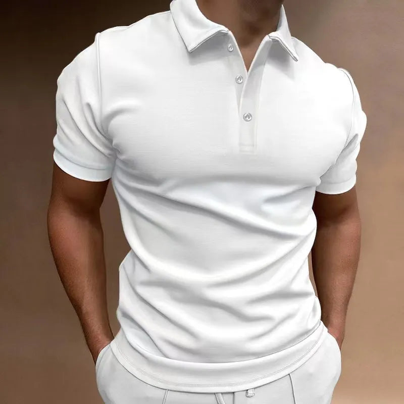 Man wearing a grey loose fit cotton blend short sleeve t-shirt for casual leisure wear.