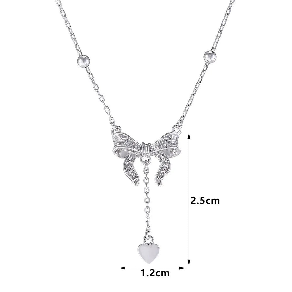 Women's 925 silver butterfly heart and bow pendant necklace on an adjustable O-ring chain.