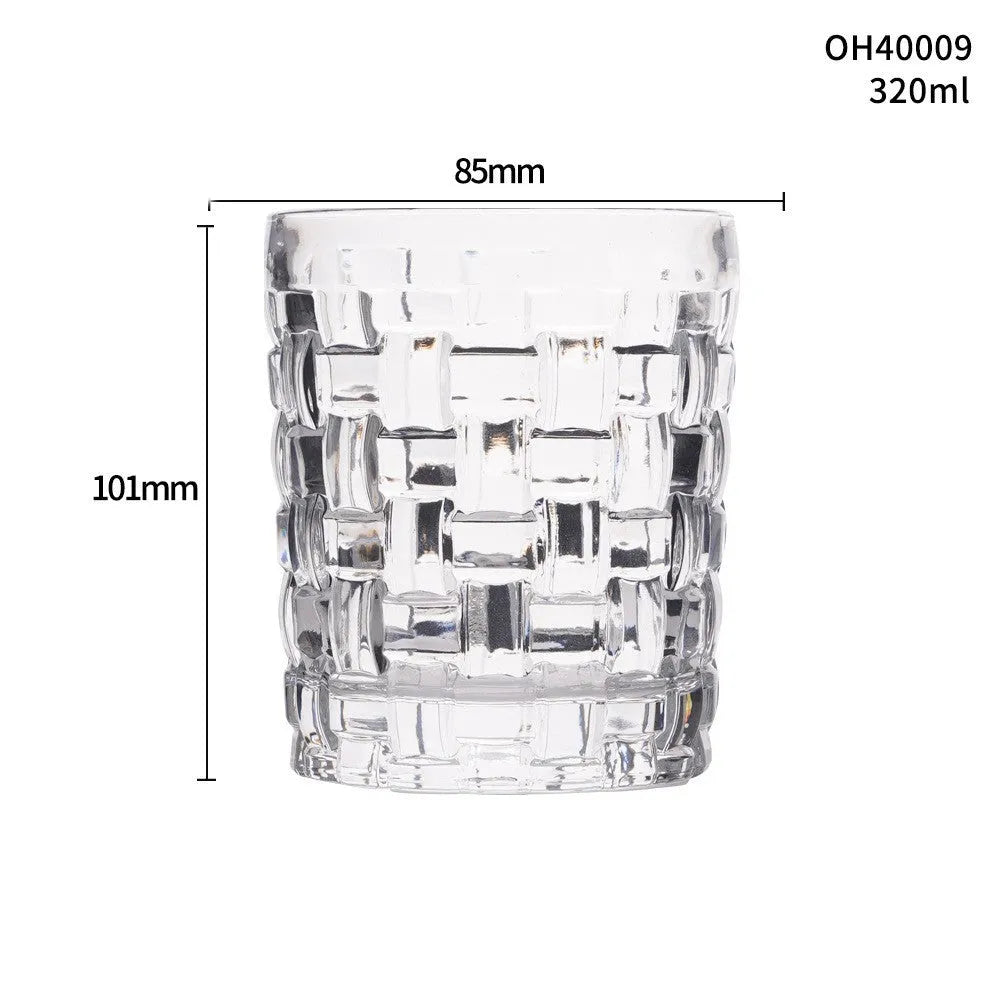 Clear thick-bottom whiskey shot glass with 301-400ml capacity on a table.