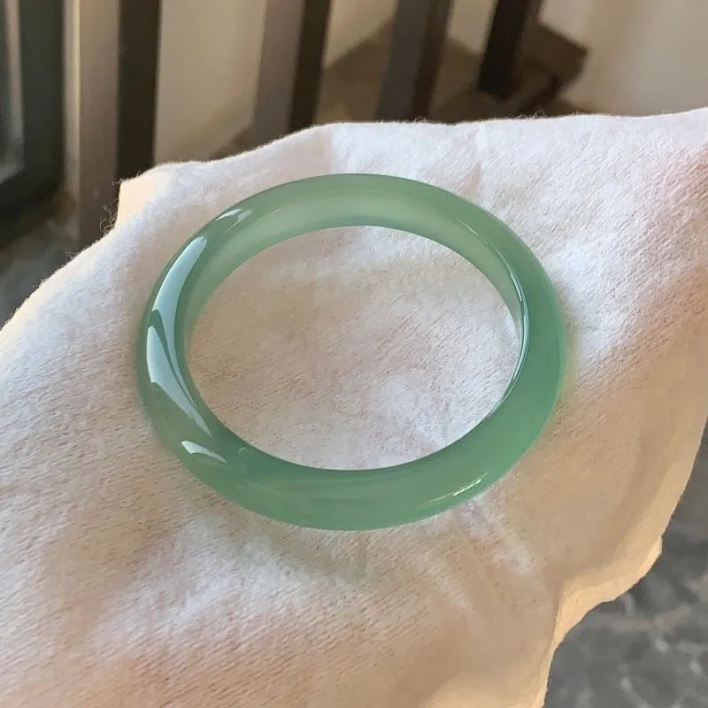 Natural agate wide tire bracelet showing polished stone band in multiple colour options