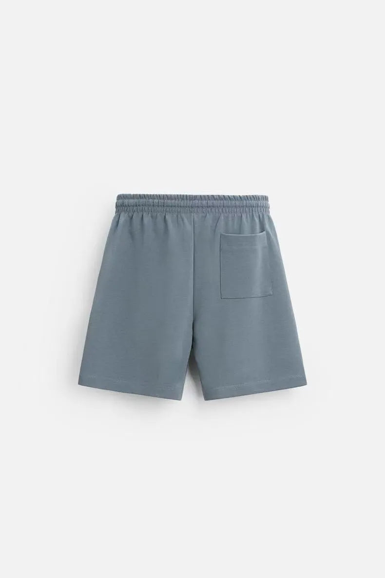 Loose-fitting short sleeve top and matching shorts set in blue, shown on a mannequin.