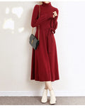 Women's rose red turtleneck long sleeve knit dress with elastic waist and loose mid-length skirt.