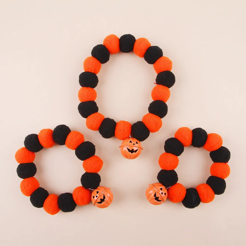 Black and orange Halloween cat collar with a trick or treat pumpkin graphic, shown in small, medium, and large sizes.