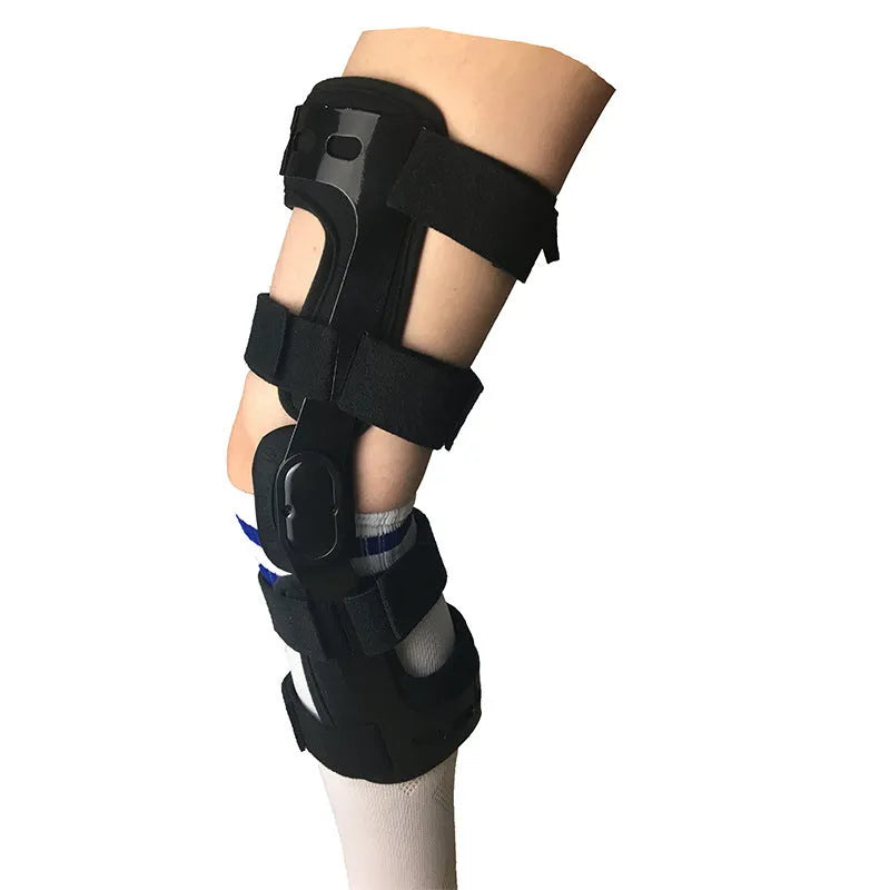 Black anterior ligament knee supporter showing sponge padding and brushed cloth lining, with size tags for left and right legs.