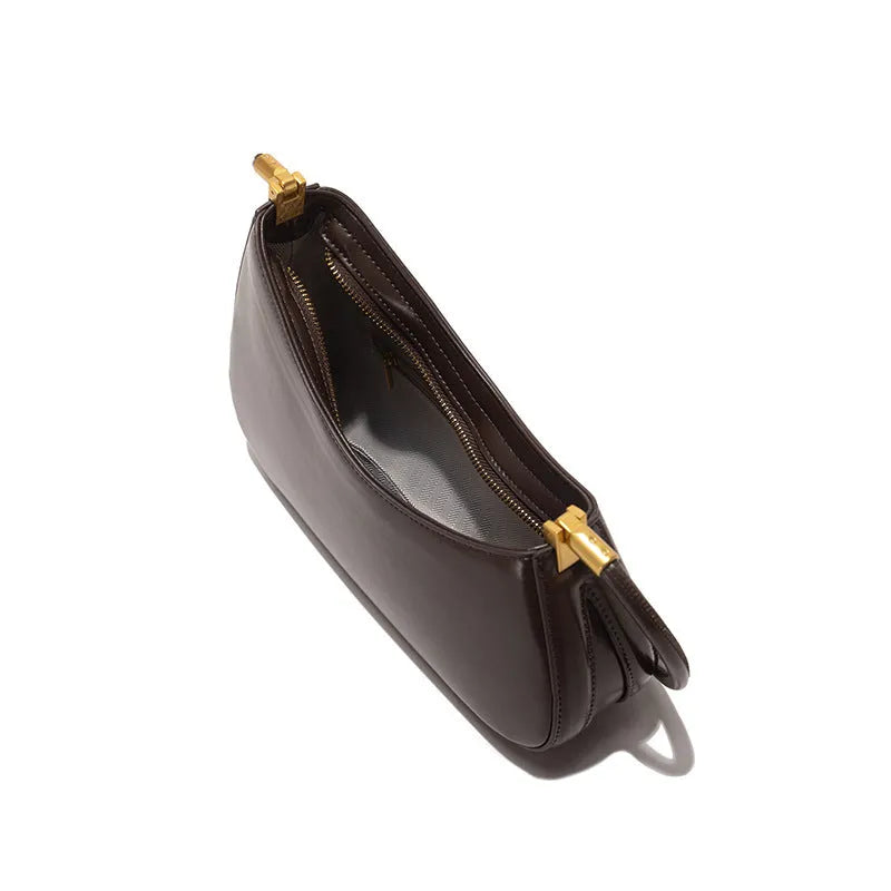 Retro oval women's underarm handbag in multiple colours, showing sandwich pocket design and single shoulder strap.