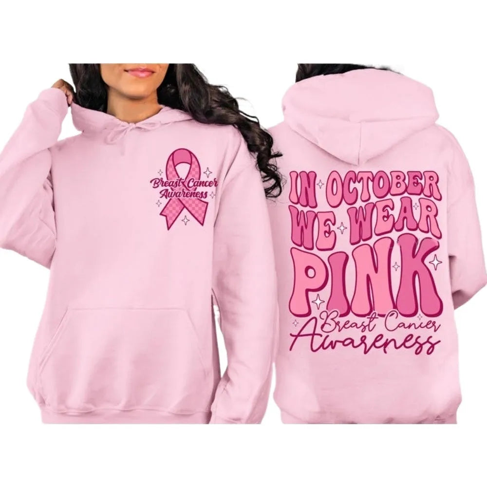 Women's pink breast cancer awareness pullover hoodie with retro graphic design and side seam pockets.