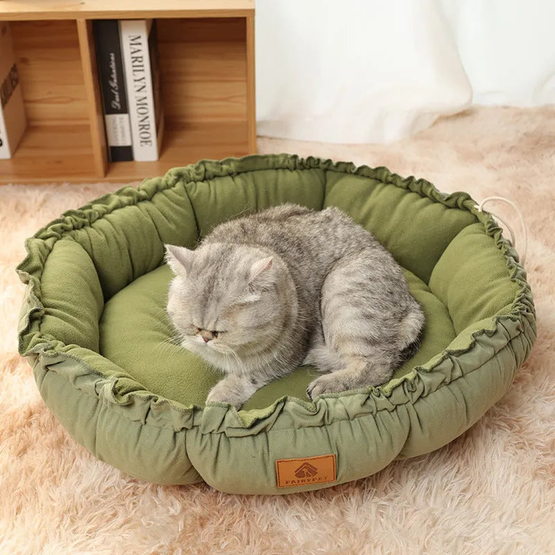 Grey reversible donut cat bed with raised rim suitable for indoor cats and small dogs