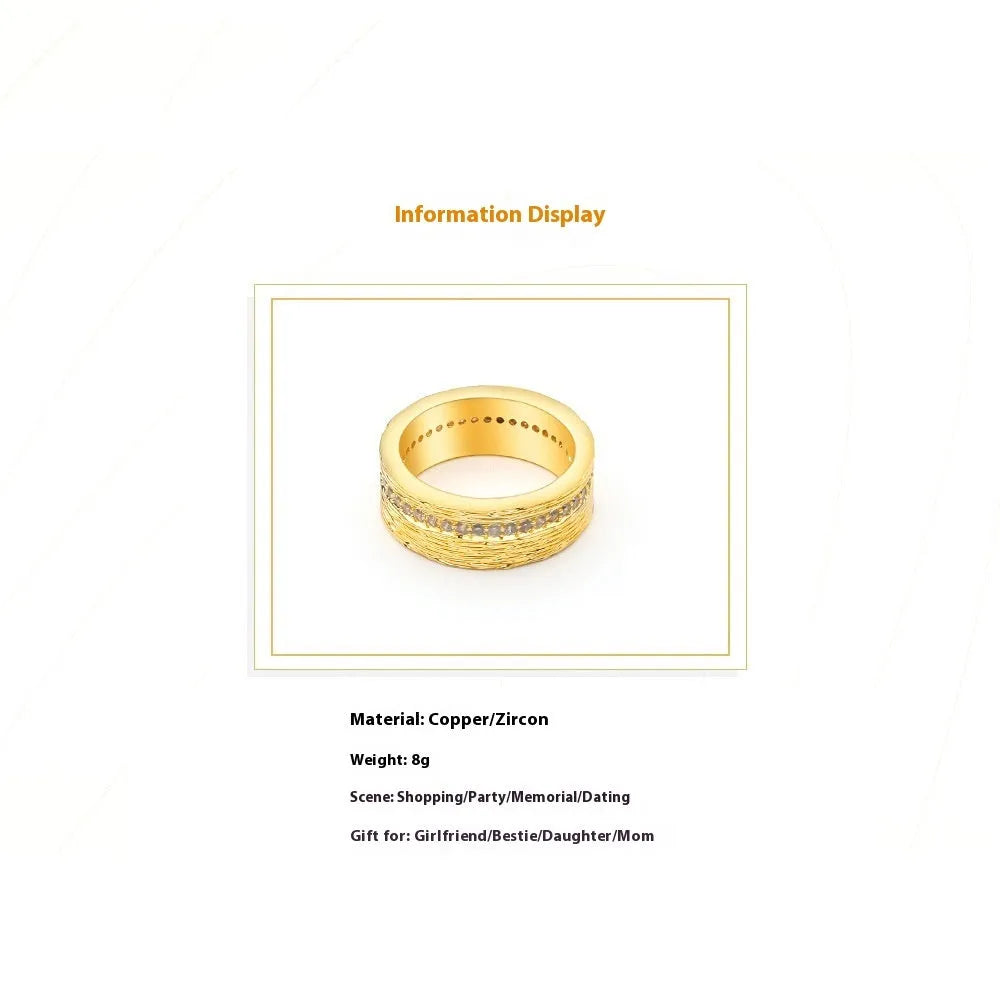 Women's geometric zircon ring in gold electroplated copper showing structured design lines