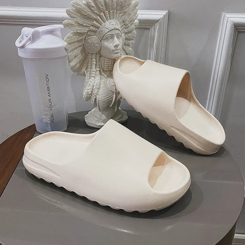 Women's thick-soled beach slippers in beige, black, brown, and green colours with injection moulded EVA construction.