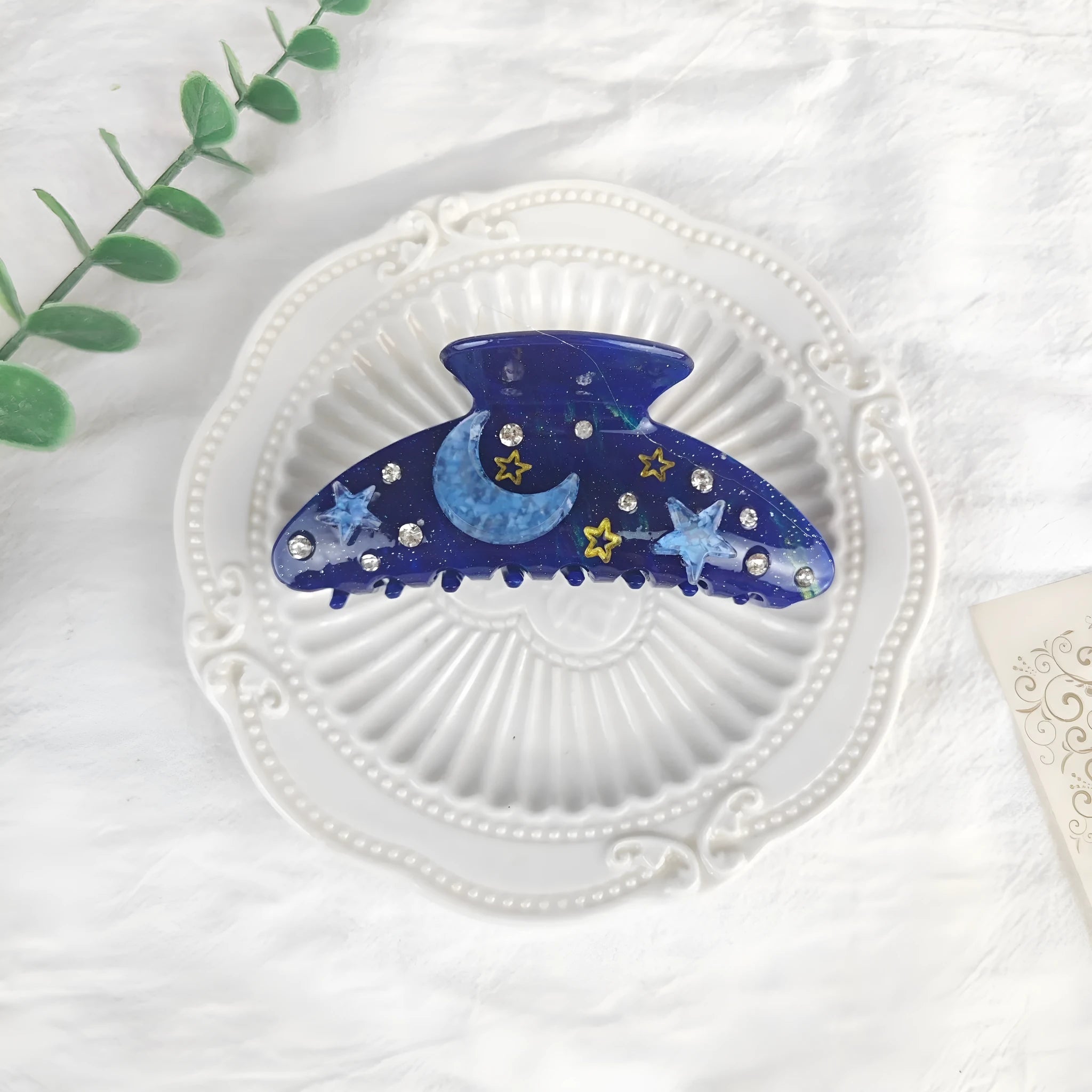 Oversized women's barrette hair clip with a starry sky pattern in sky blue.