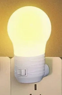 Compact round plug-in bedside baby lamp in white, blue or pink with white or warm light options