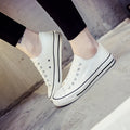 Solid colour canvas shoes for women on a plain background, showing the casual low-top design.