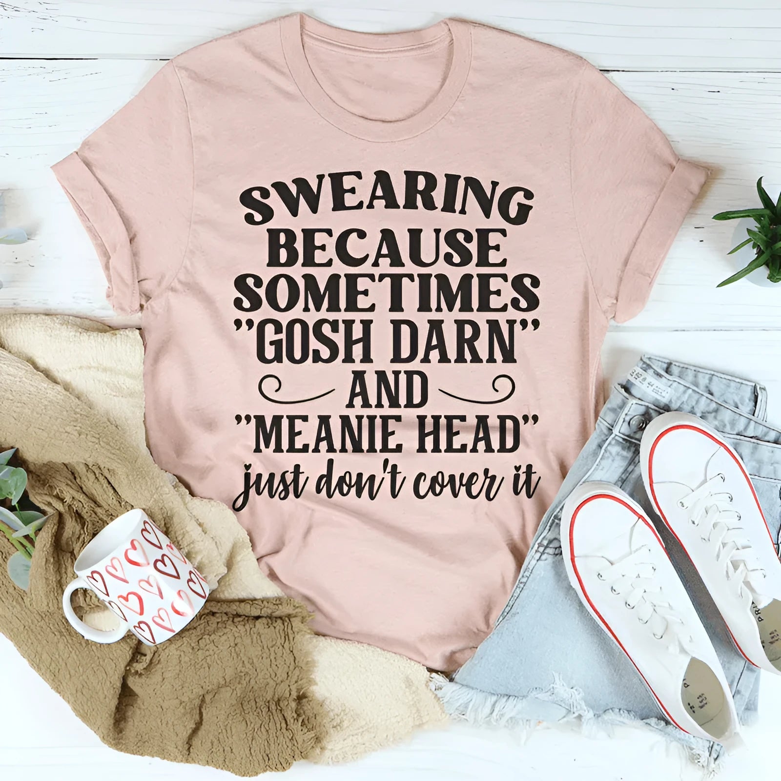 Pink couple's t-shirt with printed design showing straight cut and short sleeves