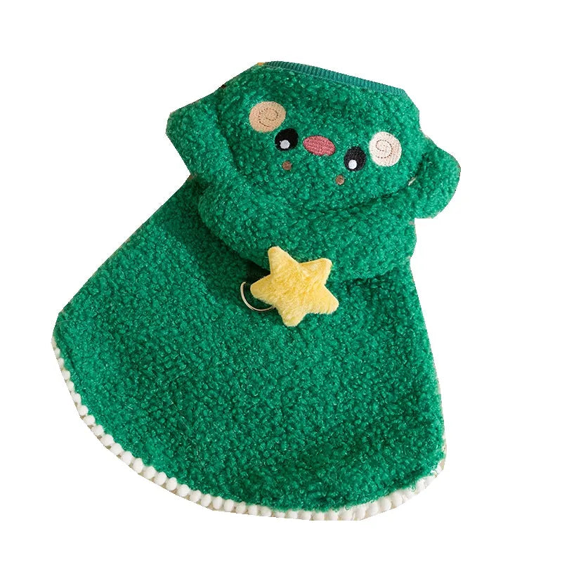 Cat wearing a green granular-velvet Christmas cape coat with a tree-shaped hat and star
