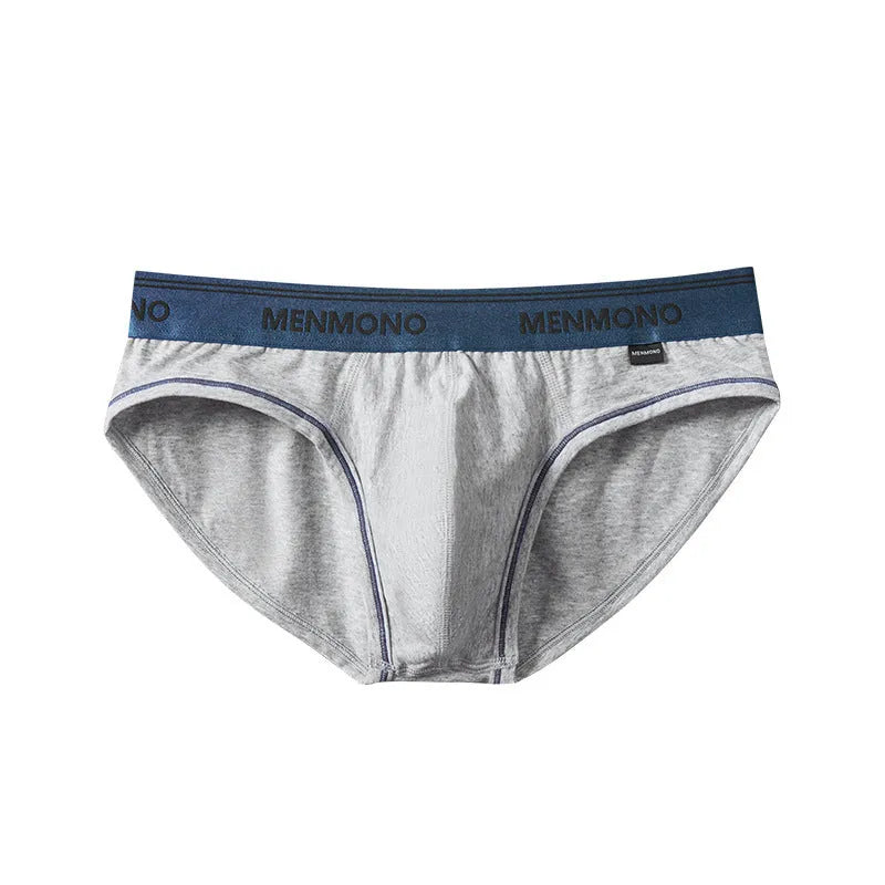 Men's low waist cotton briefs in a selection of solid colours including black and blue, white and red.