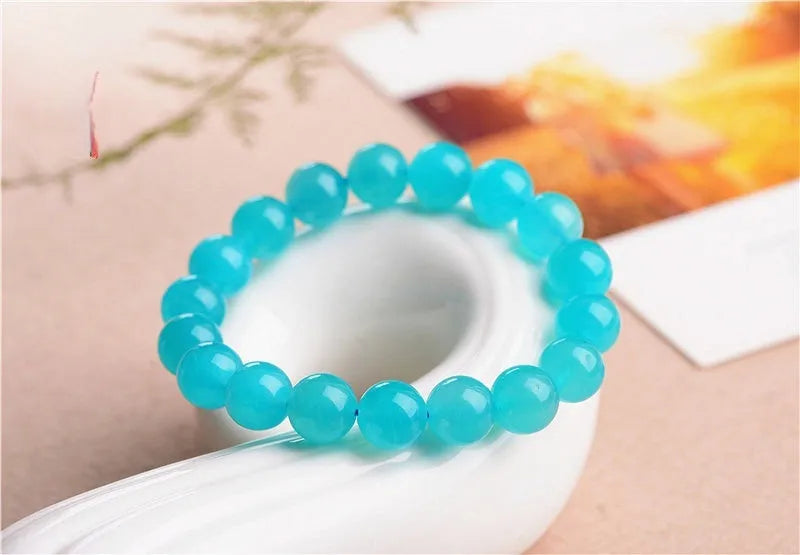 Natural 7A grade ice blue amazonite beads on a string, showing polished surfaces and varying sizes.