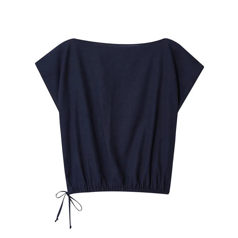 Women's linen blend co-ord suit with flounced sleeve top and wide leg trousers.