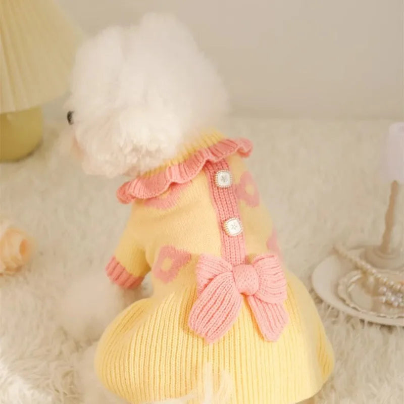 Yellow acrylic dog sweater shown on small breed pet with chest measurement guide