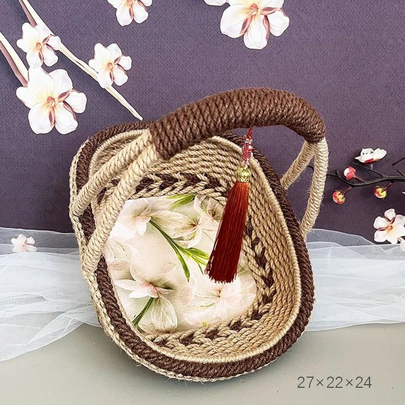 Hand-woven straw basket with hemp rope detailing in rustic style