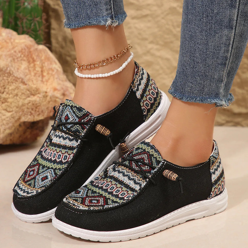Women's flat round toe shoes in black, dark grey, and khaki with a low-top design and rubber sole.