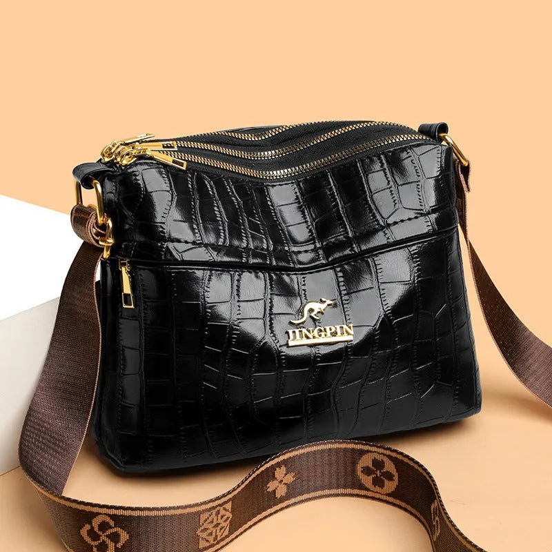 Large capacity multi compartment cross body bag in black with horizontal square shape and sewing thread detail