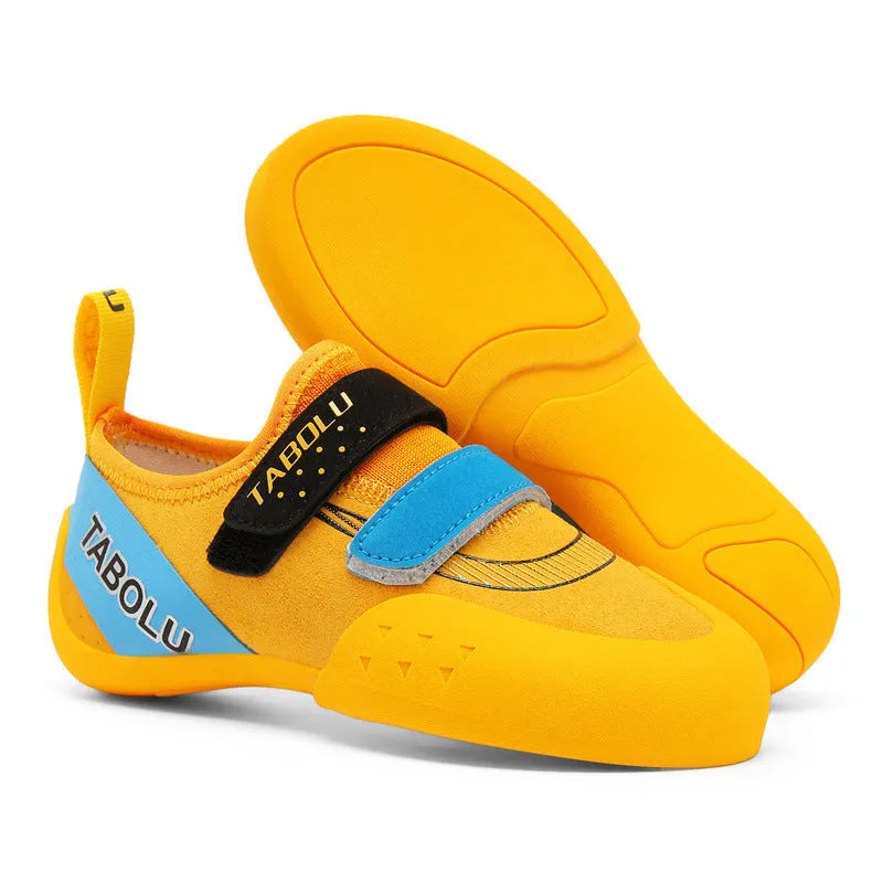 Beginner rock climbing shoes with Velcro strap in black and red colour.