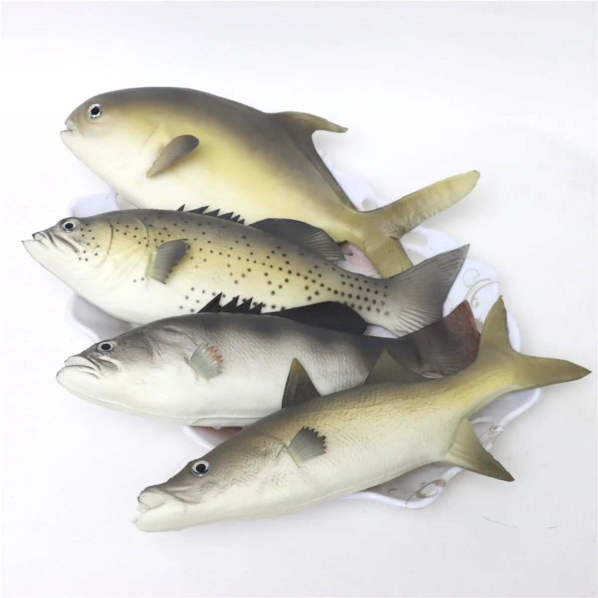 Set of three detailed PU simulated fish models: yellow-fin tuna, small tuna, and yellow croaker on a white background.