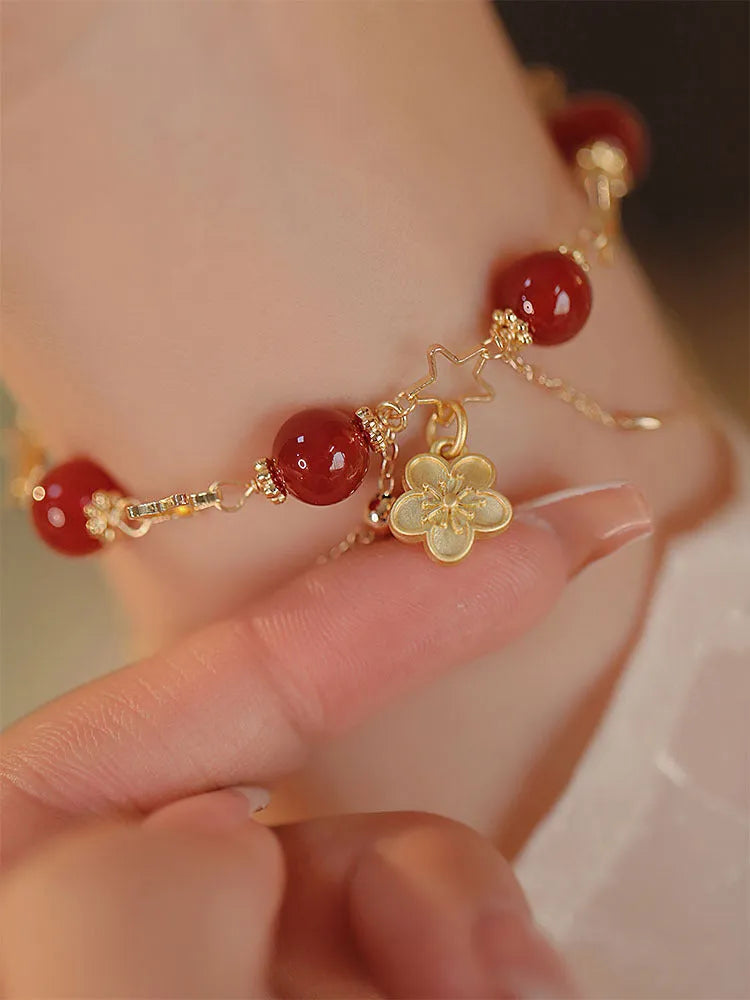 Handmade double layer red agate bracelet with peach blossom and flower design for women.