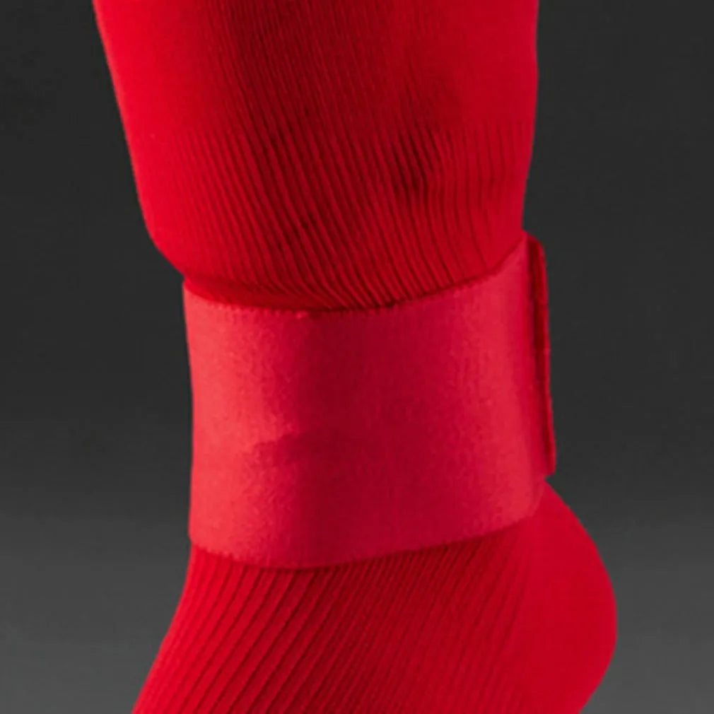 Red rubber football shin guard tape belt showing 25cm length and elastic construction