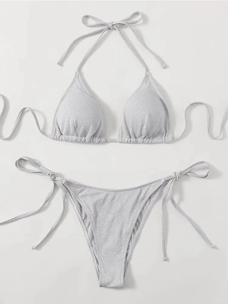 Women's bandage style bikini swimsuit in multiple colours on a size chart.