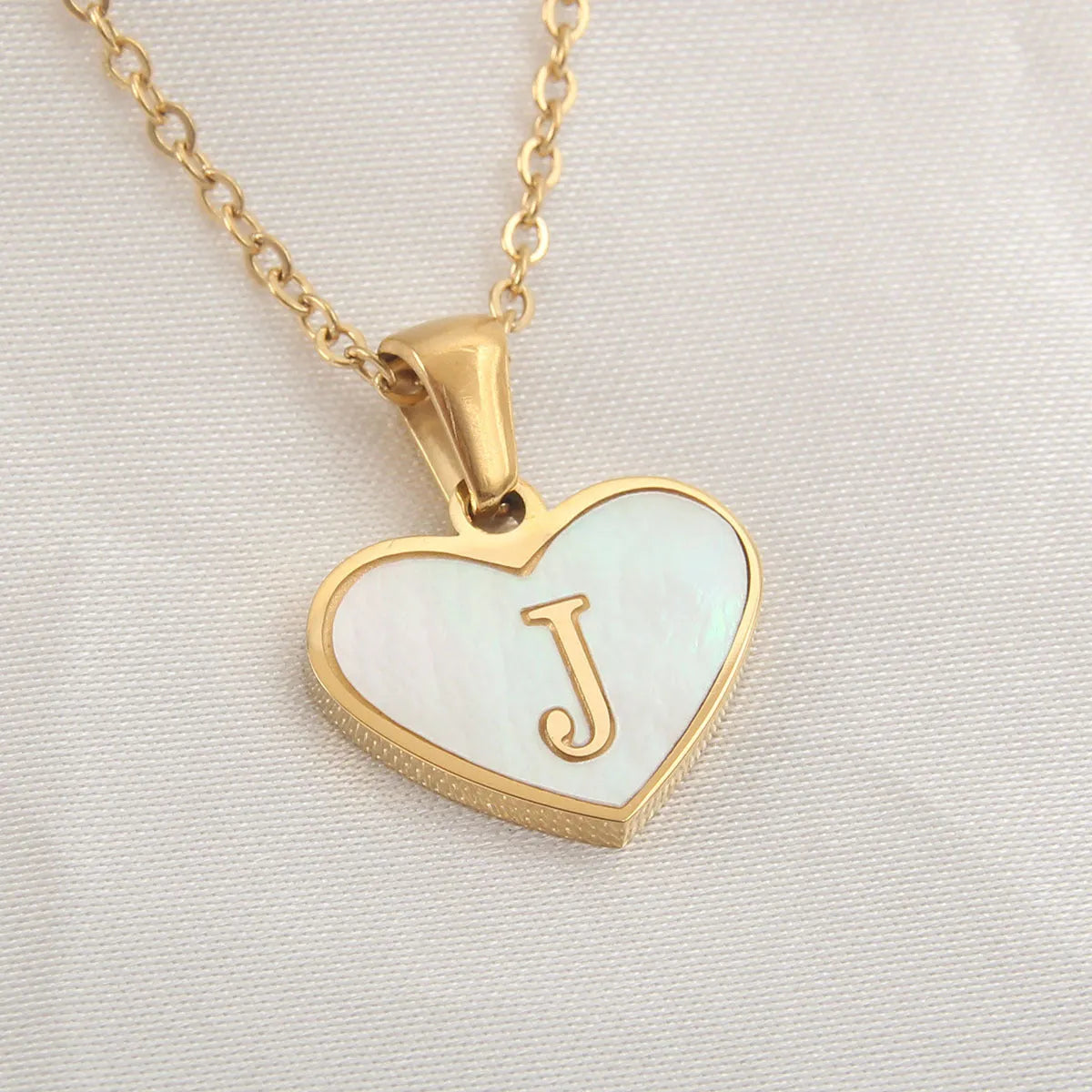 Gold plated personalised heart necklace with white shell on a 45cm chain